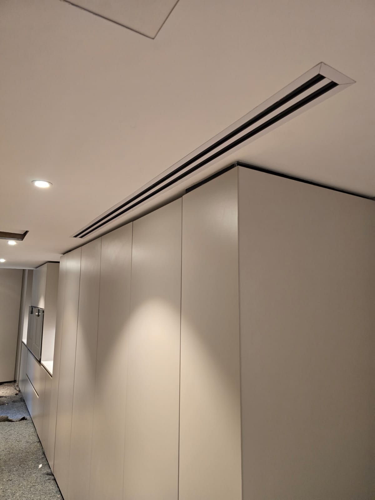 Concealed linear slot air conditioning vent in luxury interior — Airtech installation